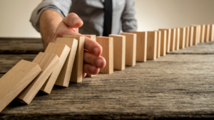 Knock Down Your Debt: How to Use the Domino Effect to Pay Off Your Loans Faster